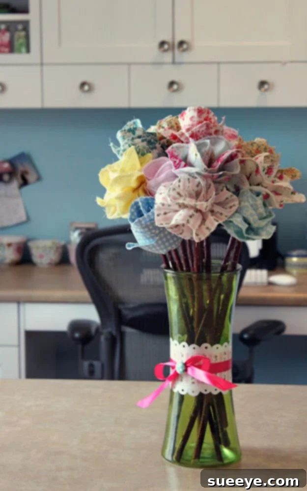 Handmade long-stemmed fabric flowers in a vase, offering everlasting bloom decor.