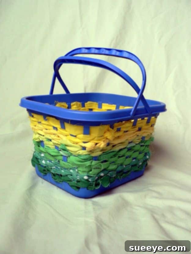 No-sew fabric scrap basket, made by wrapping fabric strips around a base, for organized storage.