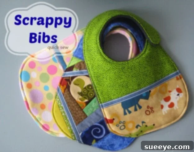 Adorable baby bibs made from a variety of colorful fabric scraps, featuring contrasting trim.