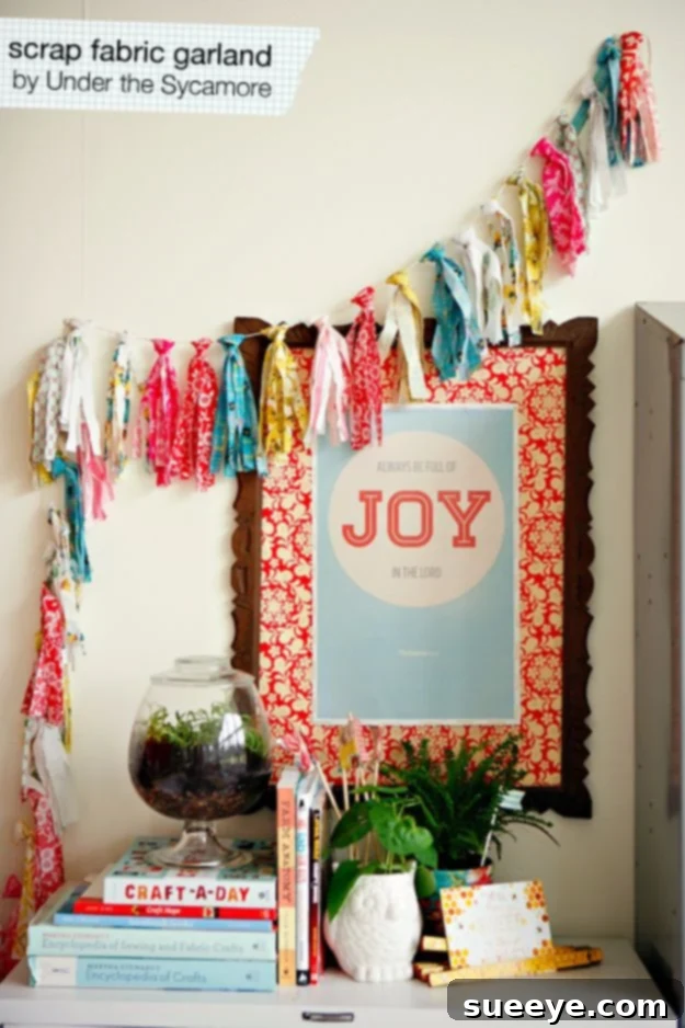 A festive garland made from strips of various colorful fabric scraps, tied to a string.