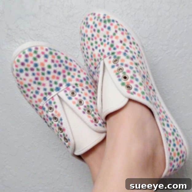 Sharpie Inspired Shoes: Easy and creative sneaker customization using permanent markers for intricate designs. White canvas sneakers with a whimsical hand-drawn design inspired by colorful Christmas lights, created with Sharpies.