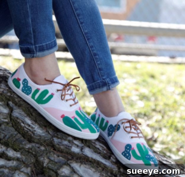 White canvas sneakers adorned with charming hand-painted green cactus designs, perfect for a desert-inspired look.