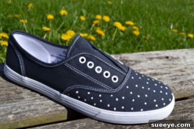 Stylish canvas sneakers featuring a classic black and white polka dot pattern for a playful look.