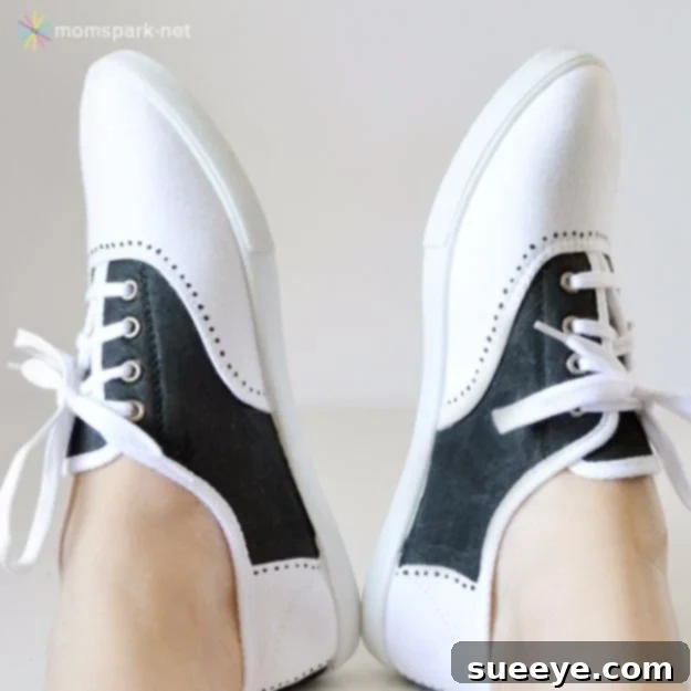 White canvas sneakers expertly painted to create a faux saddle shoe look with a contrasting color overlay.