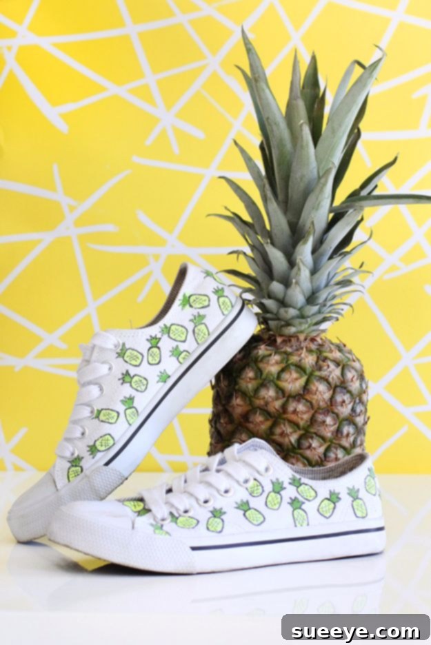 DIY Pineapple Canvas Sneakers: Create tropical-themed shoes with fabric markers or paint. White canvas sneakers hand-painted with charming yellow and green pineapple designs for a tropical vibe.