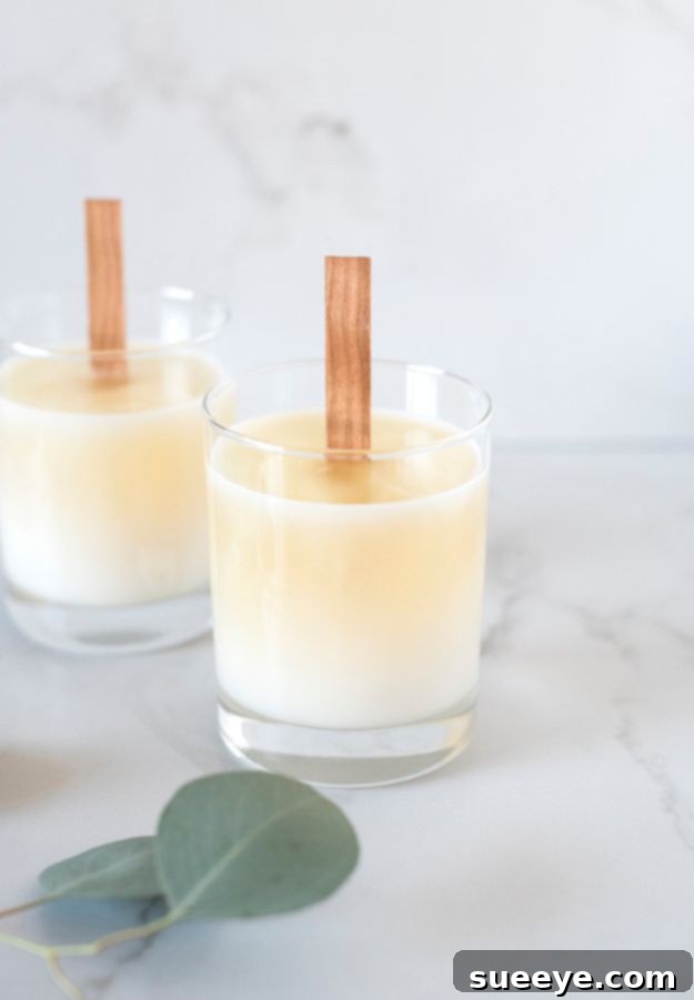 Modern wood wick soy candle in a ceramic container, offering a gentle crackling sound and clean burn.
