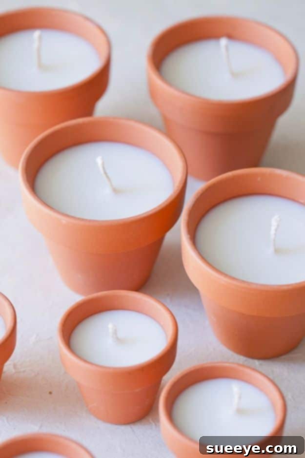 Rustic DIY terracotta votive candles, perfect for outdoor gatherings or earthy home decor.