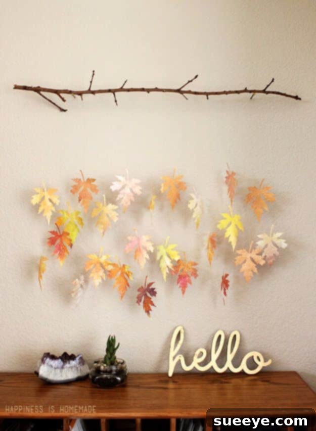 Watercolor Paper Leaf And Branch Mobile Hanging mobile with watercolor paper leaves and a natural branch