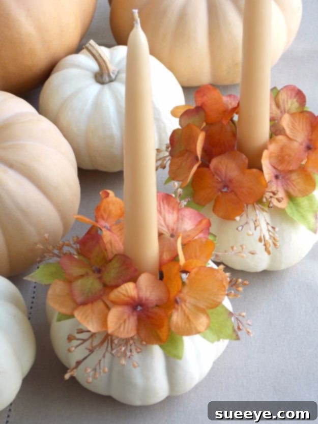 Pumpkin Candle Holder Pumpkin wreath serving as a candle holder centerpiece with fall flowers