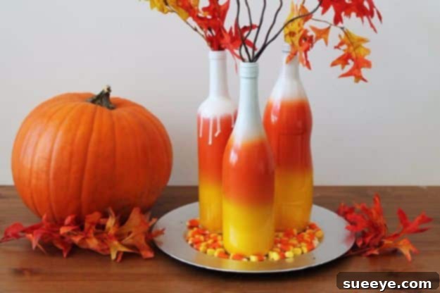 Ombre Wine Bottles Wine bottles painted with an ombre candy corn effect for fall decor
