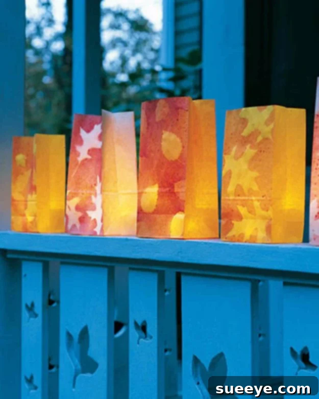 Autumn Leaf Luminarias Paper bags decorated with fall leaves and illuminated as luminarias