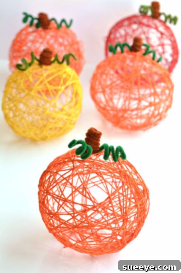 Yarn Pumpkins Using Balloons DIY yarn pumpkins made with balloons, resembling decorative gourds