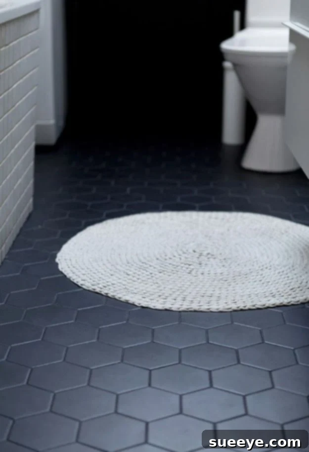 Modern bathroom with sleek large format black floor tiles