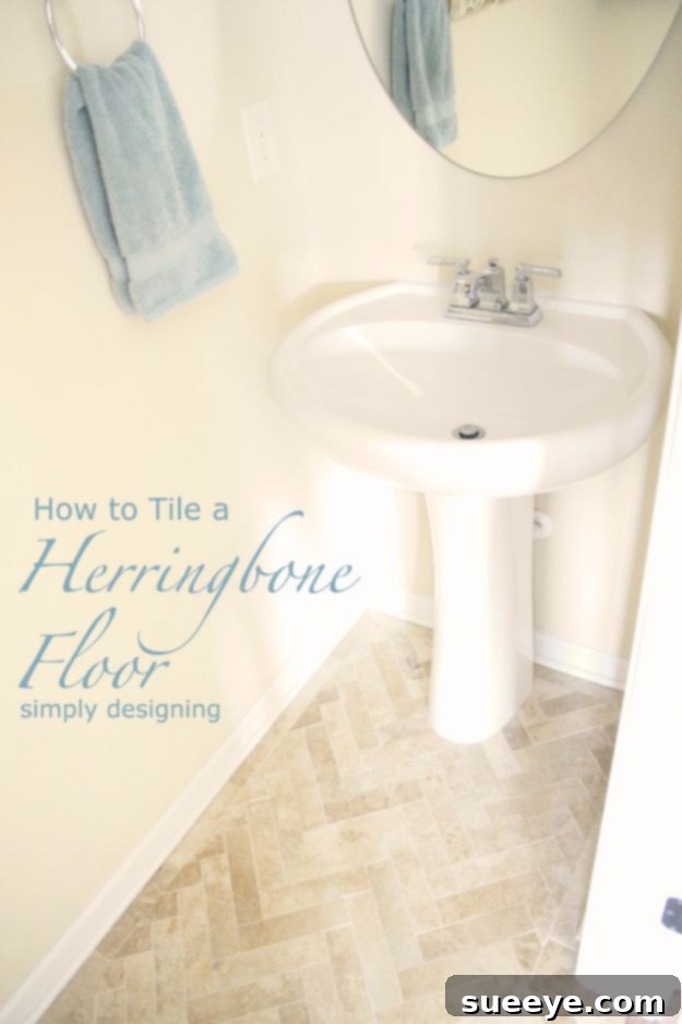 Classic white subway tile laid in a herringbone pattern on a bathroom floor