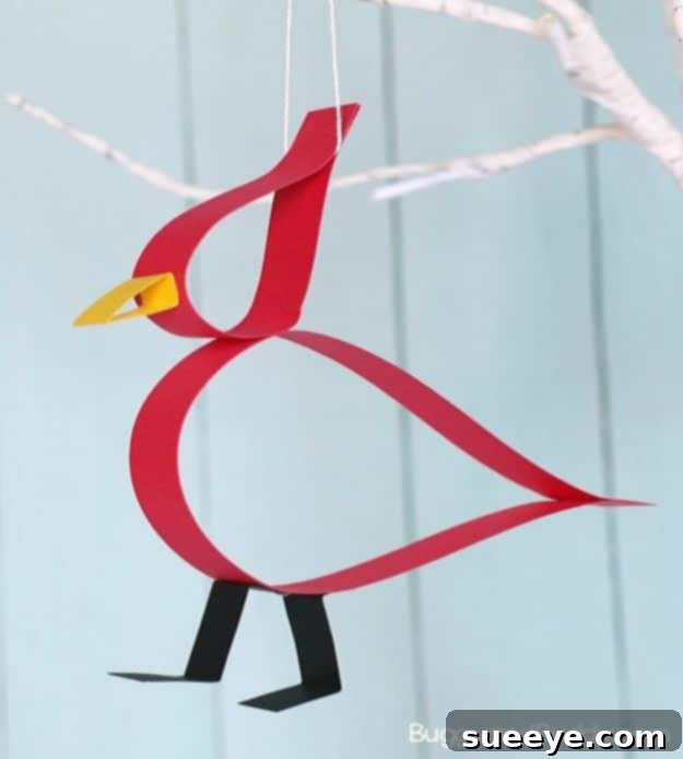 Paper cardinal craft for kids, exploring colors and shapes Red paper strip cardinal craft for kids with a free template
