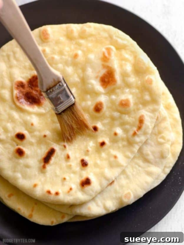 From Dough to Delicious: 50 Homemade Bread and Roll Recipes 11 Fluffy Homemade Naan bread, fresh from the pan