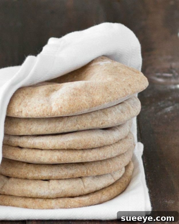 Healthy Whole Wheat Pita Bread Recipe Fluffy Homemade Whole Wheat Pita Bread rounds, ready for filling