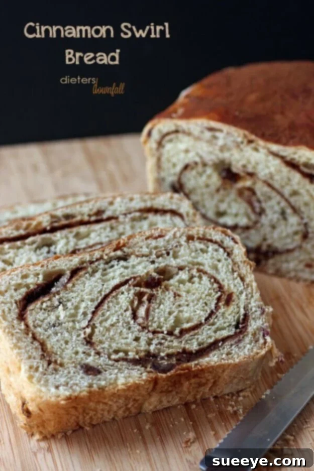 Sweet Cinnamon Raisin Bread Recipe Swirled Cinnamon Raisin Bread loaf, sliced to reveal juicy raisins