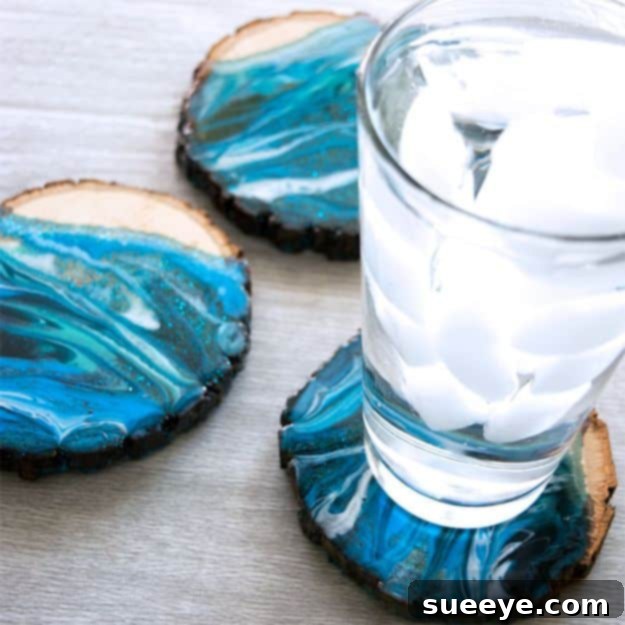 Marbled Resin Wood Coasters Stylish marbled resin wood coasters, blending natural wood with swirling pigmented resin for a chic and practical home accessory.