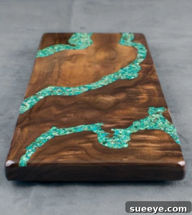 Turquoise Inlay Cheese Board Stunning turquoise inlay cheese board, featuring crushed turquoise stones set into wood with clear resin for a striking natural aesthetic.
