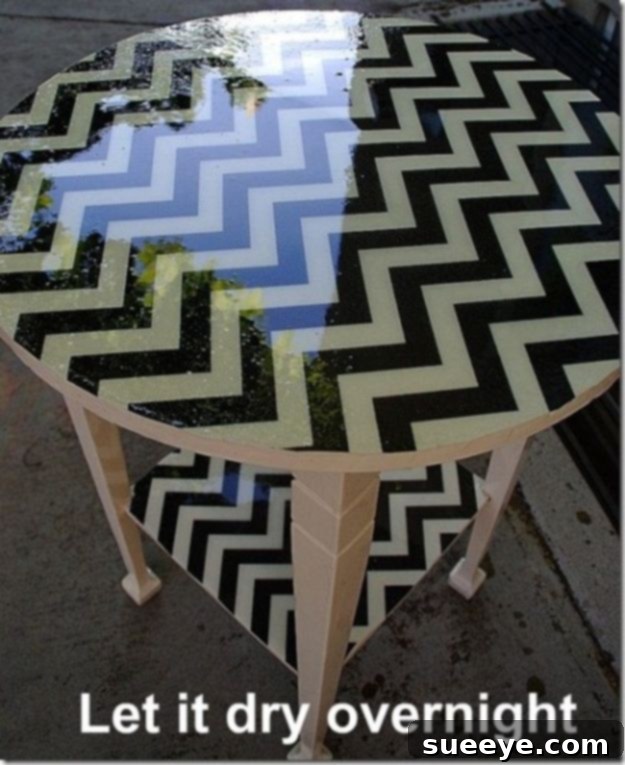 Fabric Covered Resin Table Unique fabric-covered table sealed with a clear resin top, offering a durable and customized surface for any room.