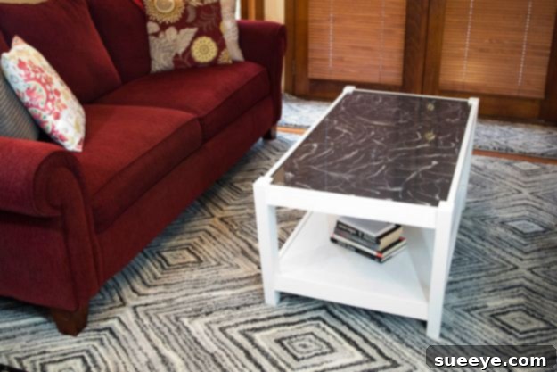 Coffee Table Refinished With Resin Stunning coffee table refinished with a glossy resin coating, providing a durable and stylish surface.