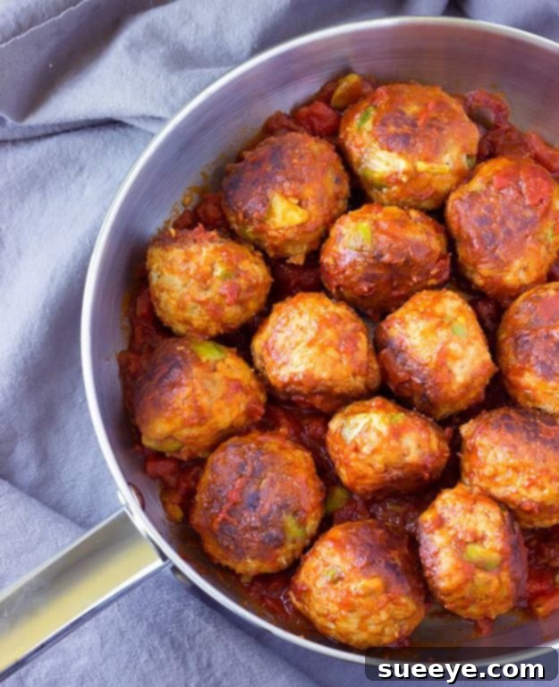 Avocado Chicken Meatballs in Spicy Tomato Sauce: A lean and flavorful meal Avocado Chicken Meatballs simmering in a spicy tomato sauce