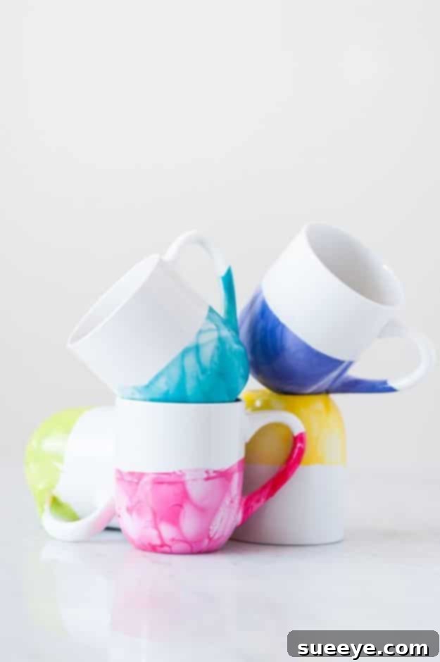 DIY Marble Dipped Mugs DIY marble-dipped mugs made from Dollar Tree white mugs