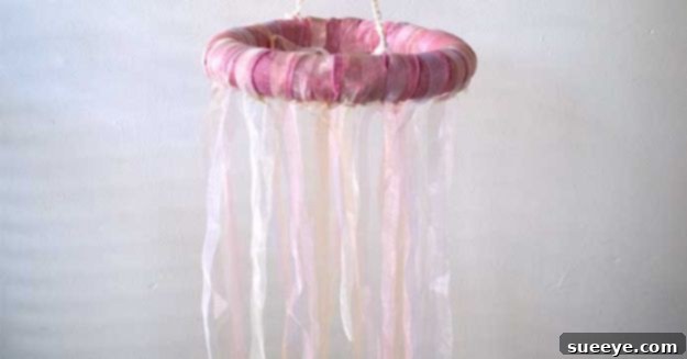 DIY Hanging Ribbon Chandelier DIY hanging ribbon chandelier made with Dollar Tree ribbons and a hoop