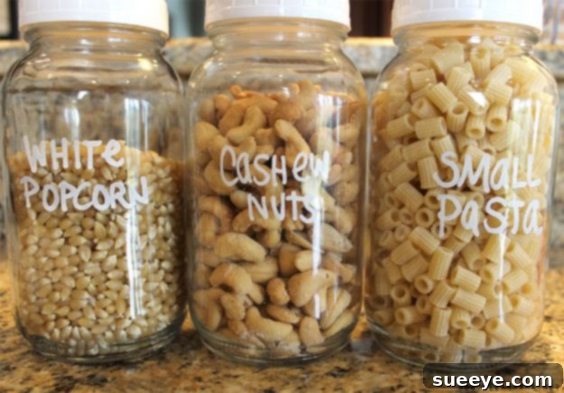 Labeled Jars for Pantry Organization Clear glass jars with elegant, minimalist labels storing various pantry staples, demonstrating effective organization and easy identification.
