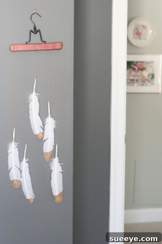 DIY Gold Dipped Feather Mobile: Boho & Chic Decor Elegant Gold Dipped Feather Mobile Wall Art for bohemian charm