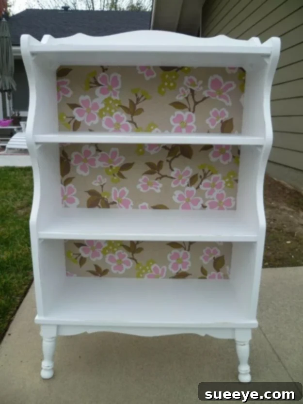 Girly Bookcase Makeover with Wallpaper Backing for Girls' Rooms