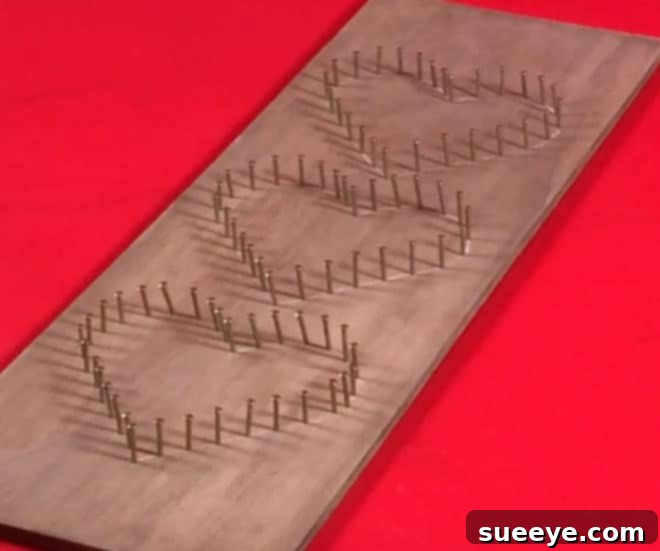 3 Beginner-Friendly String Art Projects 2 Close-up of string art supplies: hammer, nails, twine, and a wood plank