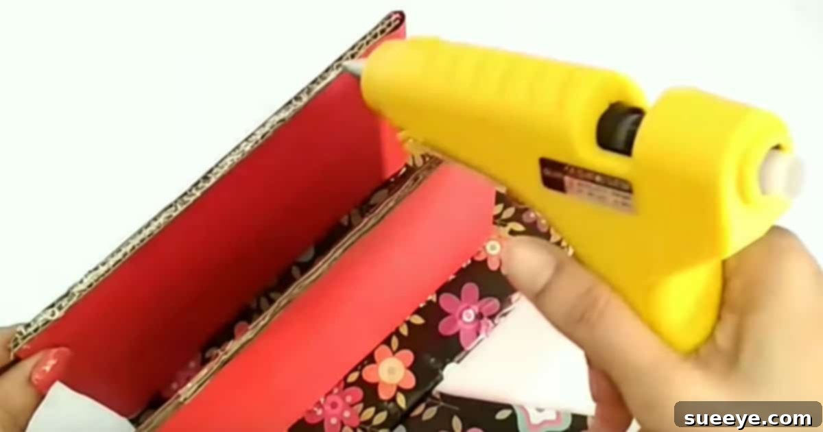 DIY cardboard spool organizer base with cardboard and wrapping paper