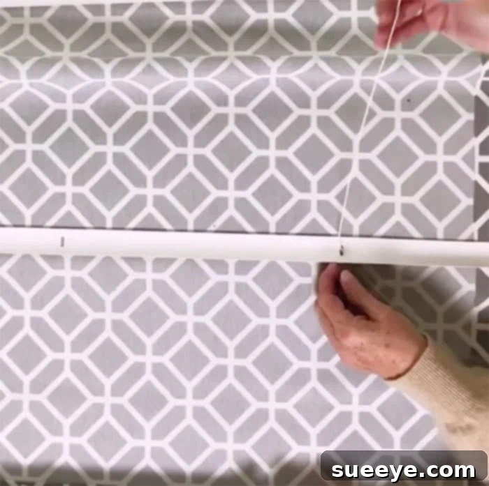 Turn a Mini Blind into a Roman Shade for Just 12 Dollars 12 Finished view of pull cords secured to the bottom bar of roman shade