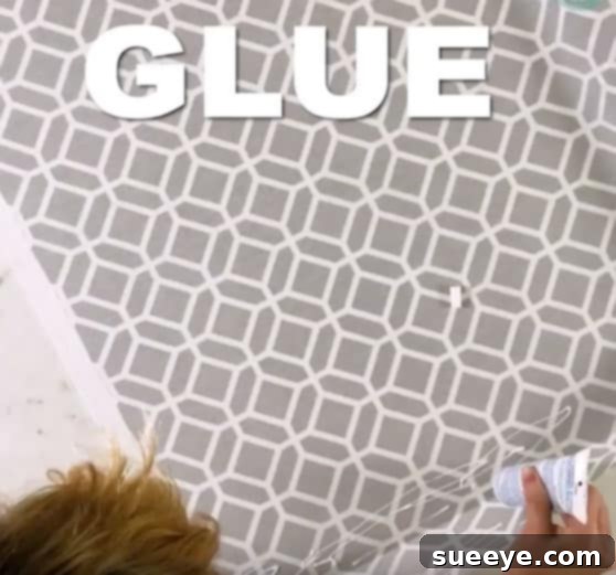 Turn a Mini Blind into a Roman Shade for Just 12 Dollars 2 Applying fabric glue for no-sew roman shades