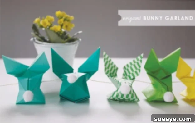 48 Creative DIY Easter Decor Projects 19 A charming garland made from delicately folded origami bunnies.