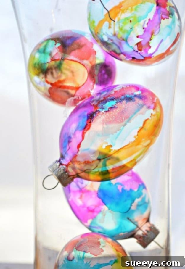 48 Creative DIY Easter Decor Projects 31 Easter eggs created with a translucent stained glass effect, catching and diffusing light beautifully.