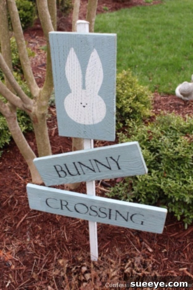 48 Creative DIY Easter Decor Projects 34 A charming DIY 'Bunny Crossing' sign made from wooden fence pickets, perfect for outdoor Easter decor.