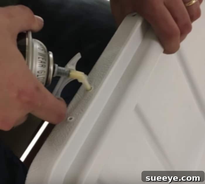 Crafting a Budget Yeti Cooler 3 DIY Cooler Build in Progress - Applying spray foam insulation