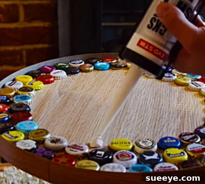 Crafting a Unique Beer Cap Table 3 Beer Cap Table 6: Close-up of beer bottle caps meticulously glued onto the tabletop, ready for epoxy.