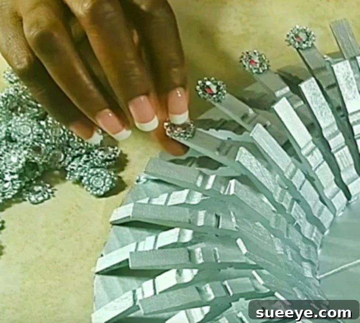 Learn to make a DIY gold clothespin mirror wall art piece for your home decor