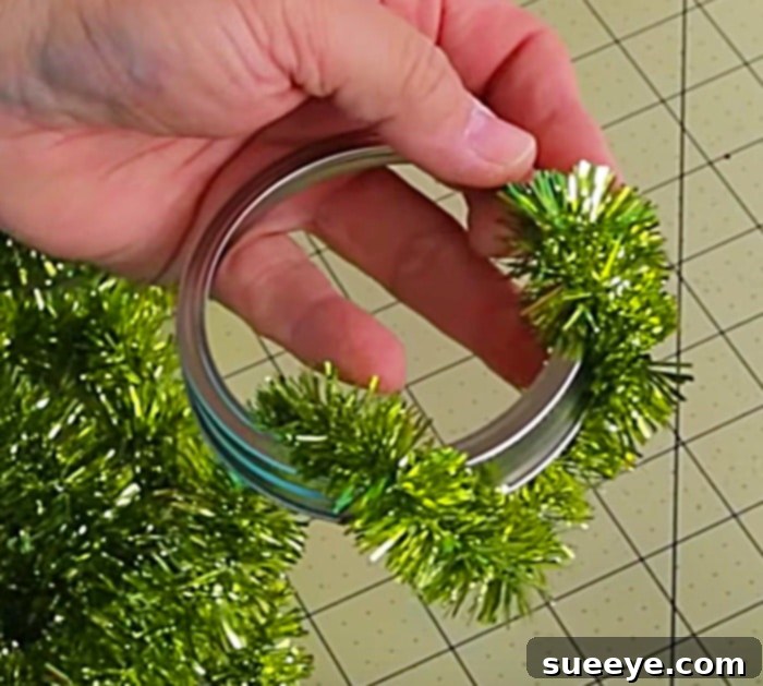 Learn to make DIY cheap Dollar Tree Mason Jar Lid Wreath Ornaments - wrapping technique