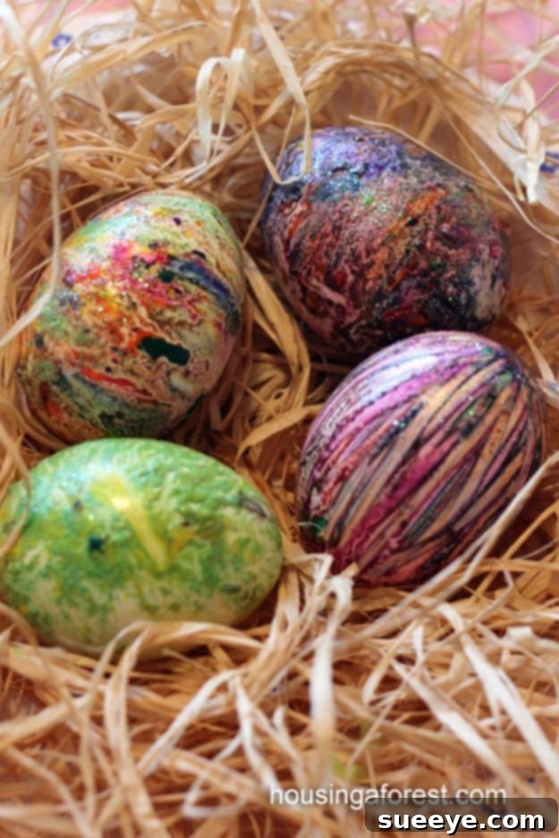 Easter eggs decorated with colorful melted crayon designs