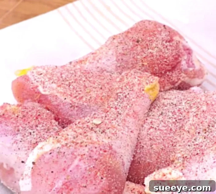 Crispy Air Fryer Southern Fried Chicken 2 Chicken pieces seasoned with dry ingredients, ready for coating