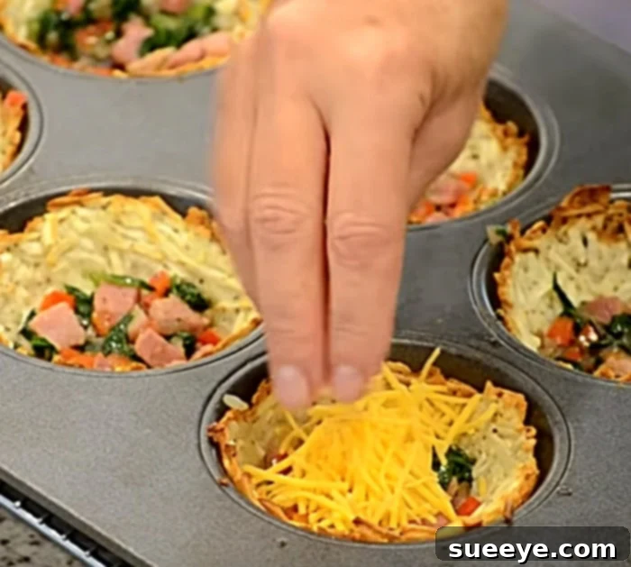 Savory Hash Brown Breakfast Muffins 2 Crispy hash brown cups filled with ham, spinach, cheese, and a perfect egg