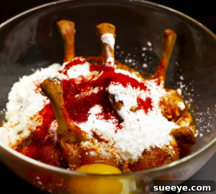 Perfect Crispy Chicken Lollipops 2 Expertly Push Down Chicken Meat to Create the Iconic Lollipop Shape for Easy and Simple Chicken Recipes
