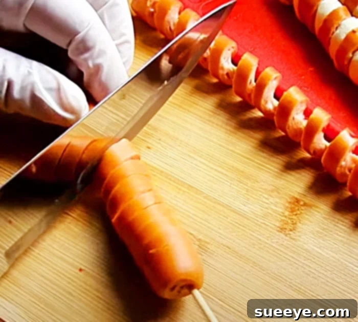 Spiral Sausage Sticks: Craft Your Own Delicious Twists 2 Spiral Sausage Recipe Made Easy - Quick Party Food Ideas - Sausage And Biscuit Wrap