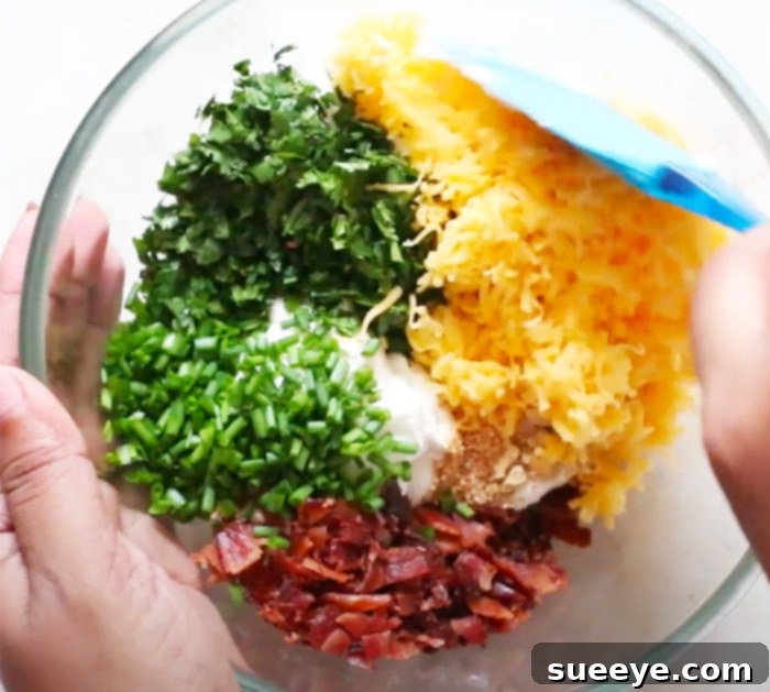 Mix all ingredients in one bowl for a delicious Cream Cheese Dip with Bacon and Cheddar, a perfect party appetizer. Ensure cream cheese is softened for a smooth consistency.