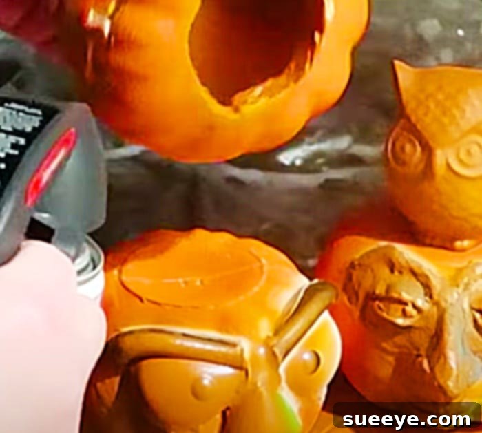 Give Dollar Tree Pumpkins a Terracotta Makeover 3 Spray Painted Pumpkins - DIY Pumpkin Crafts - Cheap Dollar Tree Fall DIY
